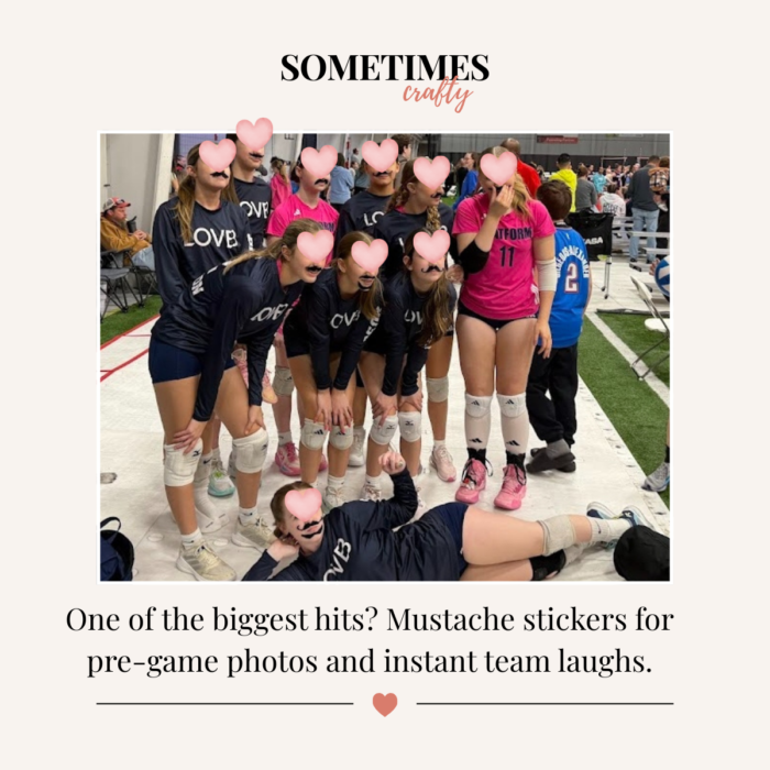 olleyball team posing together wearing fake mustache stickers before games at a tournament.