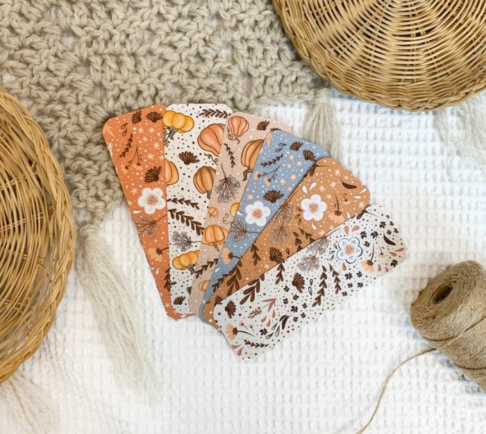 Cozy fall boho bookmarks in neutral colors, featuring fall florals and pumpkins.