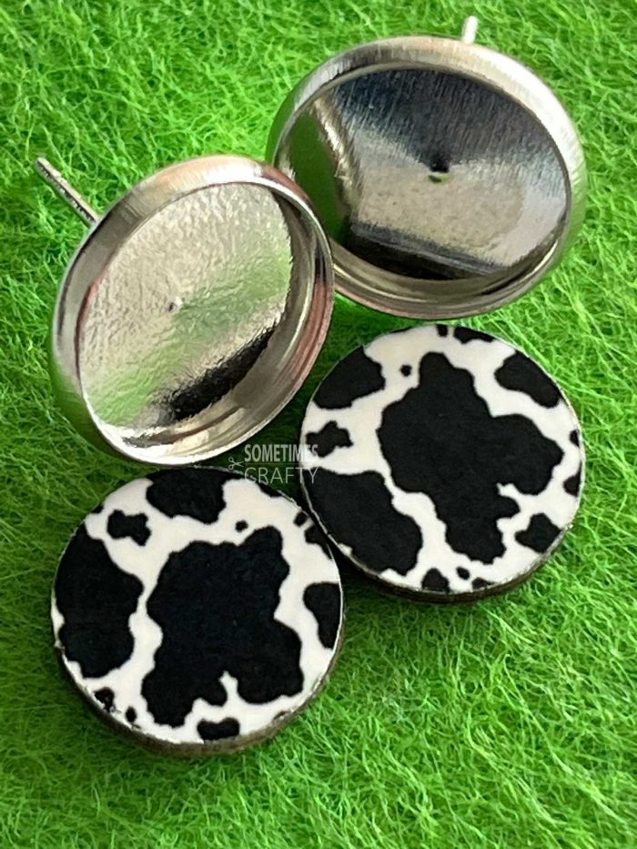 Cow print earrings and silver bezel